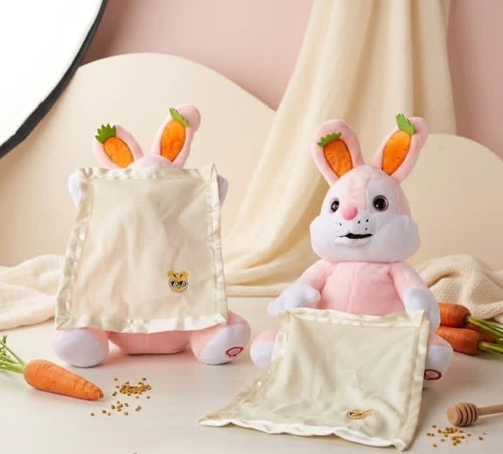 Plush stuffed bunny rabbit with attached blanket