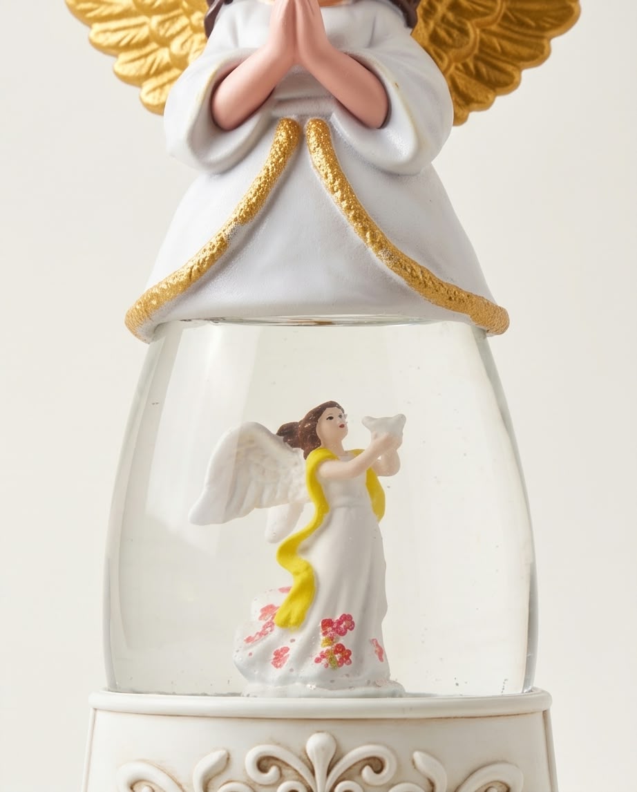illuminated Christmas angel snow globe